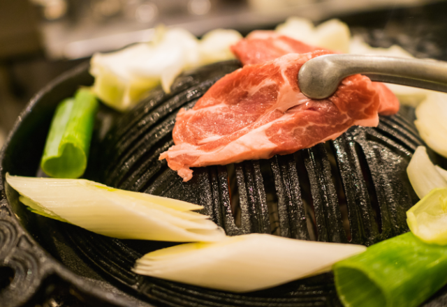 Close-up of Jingisukan (Genghis Khan) barbecue, a popular grilled lamb dish in Hokkaido.