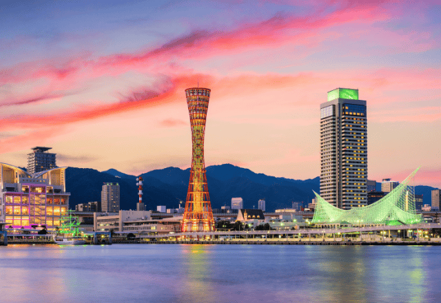 Kobe skyline at sunset, featuring Kobe Port Tower and the iconic waterfront area.