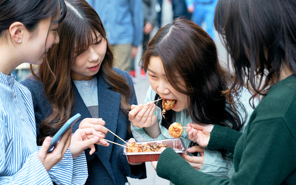 Japanese people eating in the street