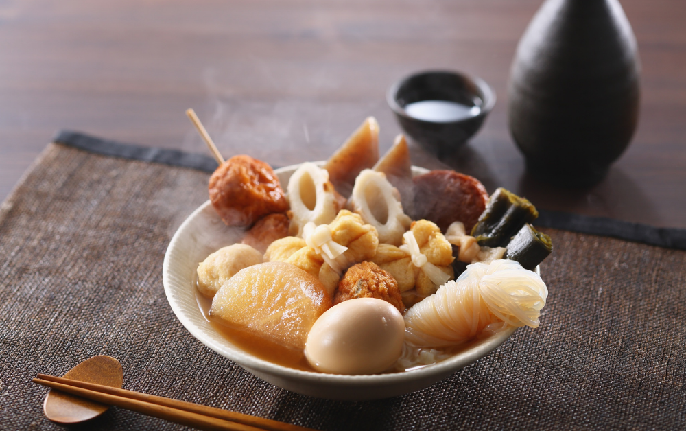 Oden (おでん) – a comforting stew of daikon, boiled eggs, tofu, and fish cakes simmered in dashi broth. Found in convenience stores all winter long.