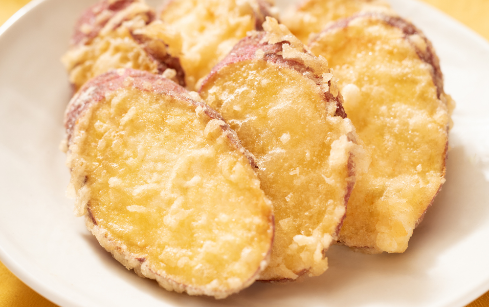 Satsumaimo Tempura (さつまいも天ぷら) – lightly battered and fried sweet potato slices, crispy outside and soft inside.